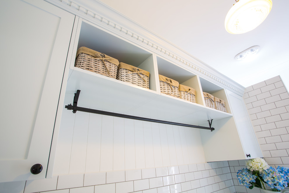 Inspiration for a large traditional galley utility room in Brisbane with a farmhouse sink, shaker cabinets, white cabinets, quartz benchtops, white walls and ceramic floors.