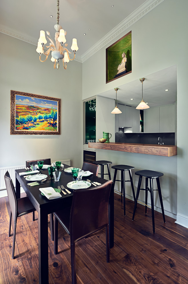 Inspiration for a contemporary kitchen/dining combo in Surrey with grey walls, dark hardwood floors and no fireplace.