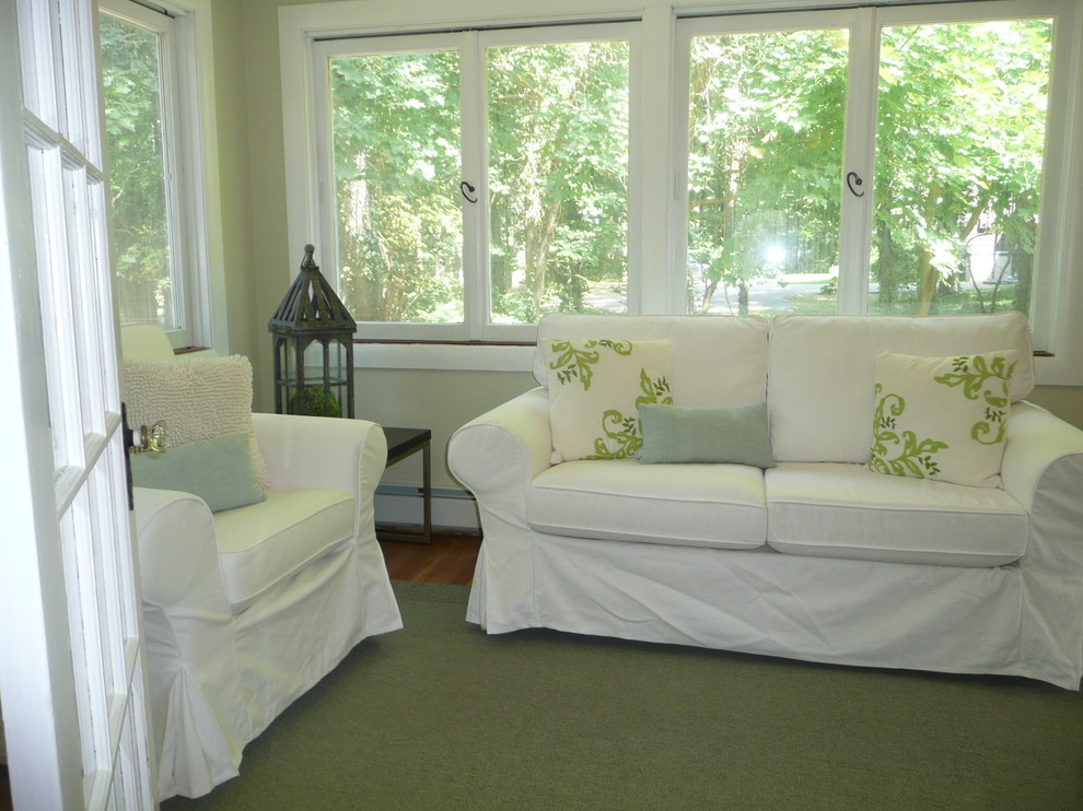 This is an example of a small transitional sunroom in Boston with medium hardwood floors and a standard ceiling.