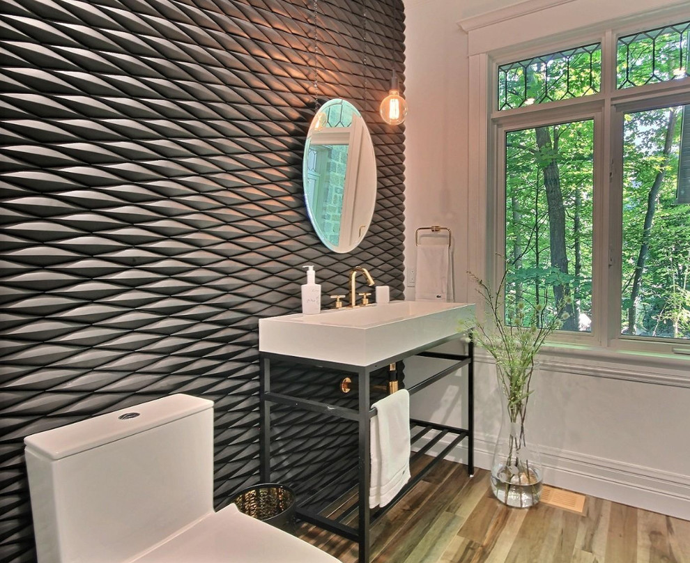 Inspiration for a mid-sized contemporary 3/4 bathroom in Montreal with a one-piece toilet, white walls, medium hardwood floors, a console sink, open cabinets, black cabinets, black tile, stainless steel benchtops, ceramic tile and brown floor.