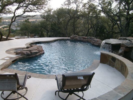 Inspiration for a contemporary backyard custom-shaped pool in Austin.