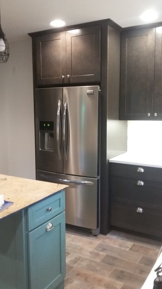 Inspiration for a mid-sized rustic u-shaped porcelain tile eat-in kitchen remodel in Indianapolis with a farmhouse sink, shaker cabinets, dark wood cabinets, wood countertops, white backsplash, ceramic backsplash, stainless steel appliances and an island