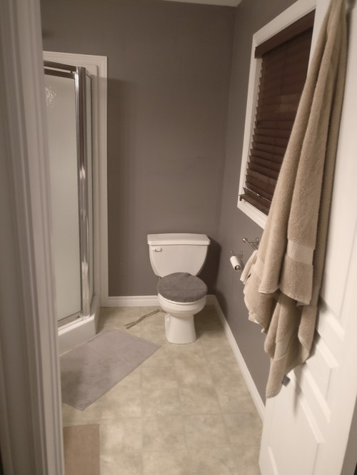 Modern bathroom with curbless shower and hexagon tiles on Craiyon