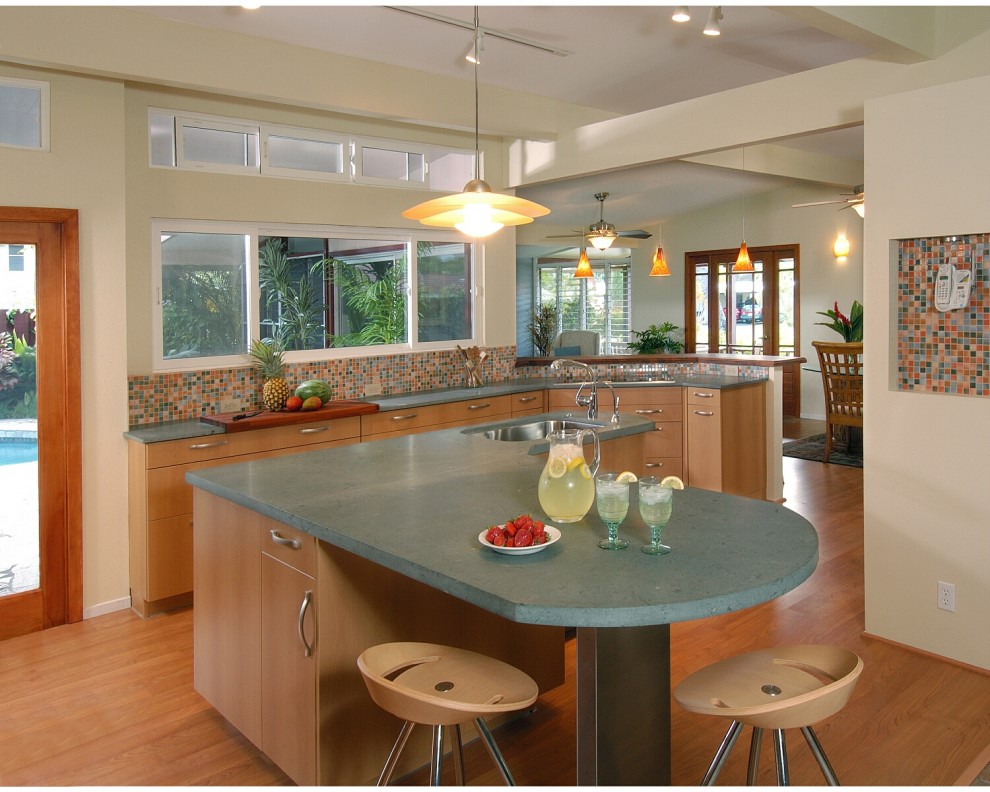 Inspiration for a contemporary eat-in kitchen in Hawaii with an undermount sink, flat-panel cabinets, medium wood cabinets, multi-coloured splashback, mosaic tile splashback and green benchtop.