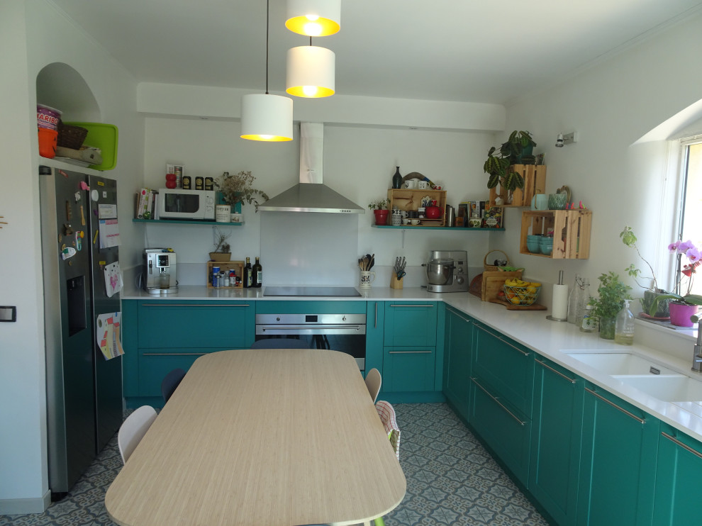 Design ideas for a large traditional l-shaped kitchen in Marseille with an undermount sink, recessed-panel cabinets, turquoise cabinets, quartzite benchtops, white splashback, stainless steel appliances, cement tiles, no island, blue floor and white benchtop.