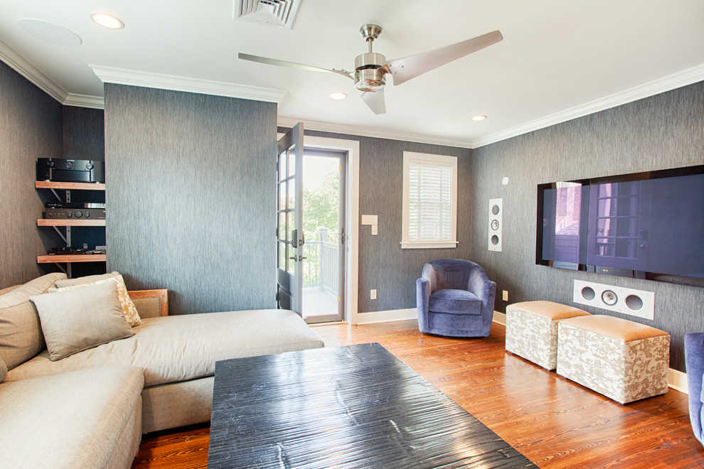 Mid-sized modern enclosed family room in Philadelphia with grey walls, dark hardwood floors and a wall-mounted tv.