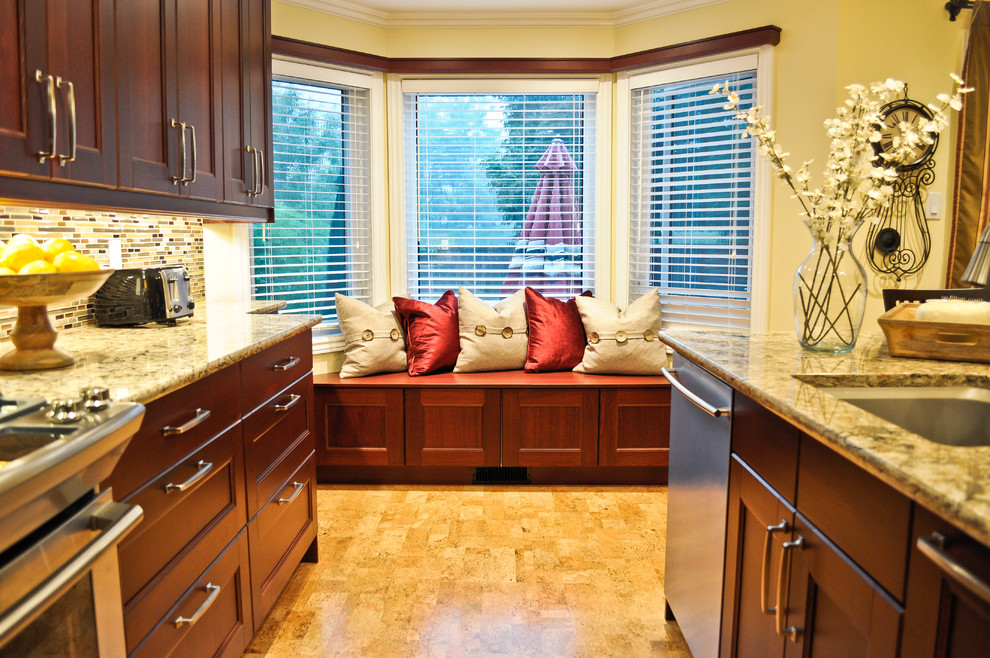 Kitchen - transitional cork floor kitchen idea in Ottawa with recessed-panel cabinets, brown cabinets, quartzite countertops, multicolored backsplash, mosaic tile backsplash, stainless steel appliances and an island