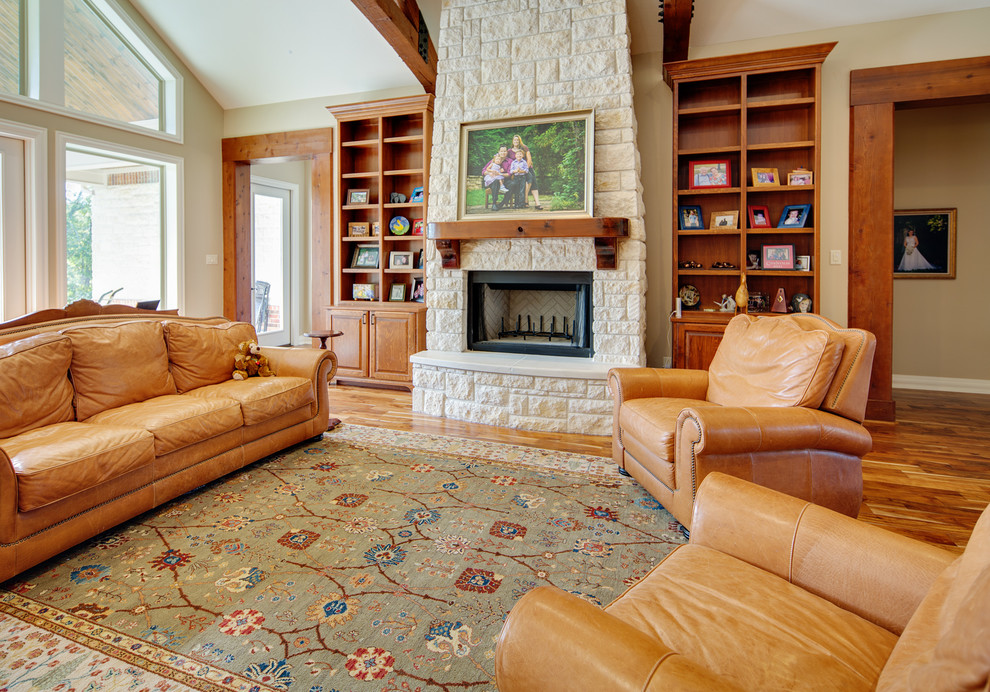 Design ideas for a large transitional formal open concept living room in Austin with beige walls, medium hardwood floors, a standard fireplace and a stone fireplace surround.