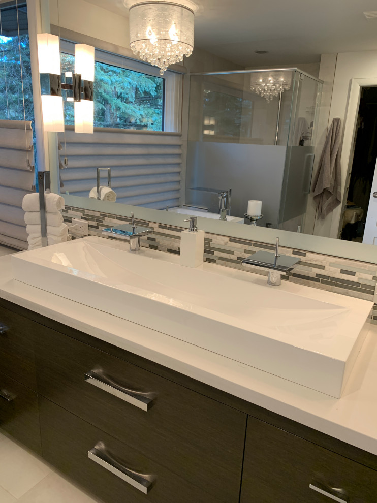 Design ideas for a mid-sized transitional master bathroom in Calgary with flat-panel cabinets, white cabinets, a freestanding tub, beige walls, a trough sink, engineered quartz benchtops and white benchtops.