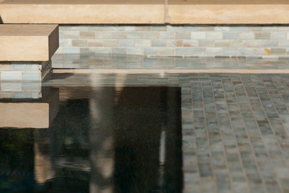 Large elegant backyard stone and rectangular lap pool house photo in Austin