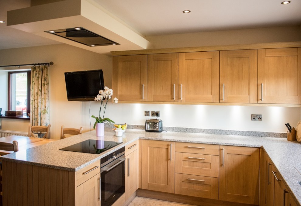 This is an example of a mid-sized traditional kitchen in Other with glass sheet splashback.