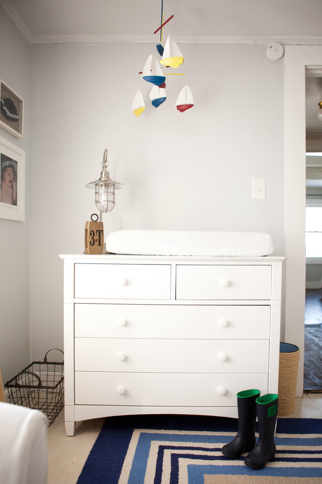 Photo of a traditional nursery for boys in Boston with grey walls and carpet.