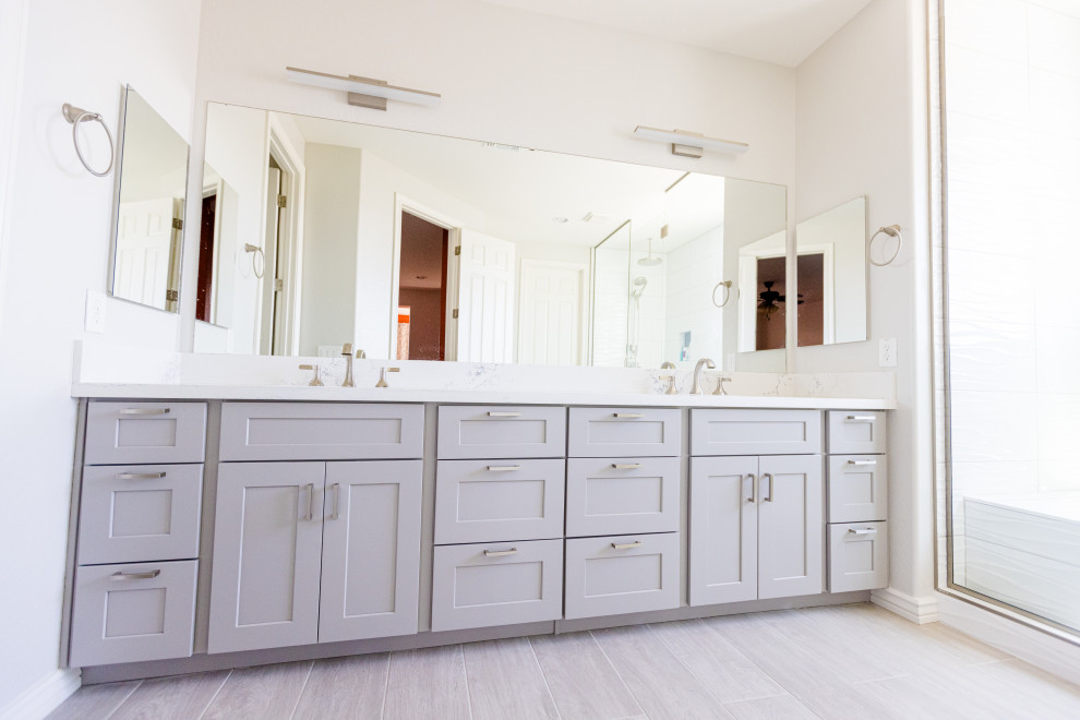 Photo of a large transitional master bathroom in Phoenix with shaker cabinets, grey cabinets, a double shower, white tile, cement tile, white walls, wood-look tile, an undermount sink, quartzite benchtops, grey floor, a hinged shower door, white benchtops, a shower seat, a double vanity and a built-in vanity.