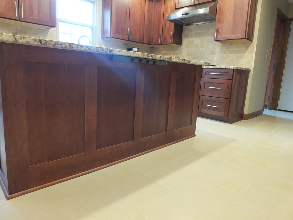Eat-in kitchen - mid-sized transitional l-shaped ceramic tile eat-in kitchen idea in Columbus with an undermount sink, shaker cabinets, brown cabinets, granite countertops, beige backsplash, ceramic backsplash, stainless steel appliances and an island