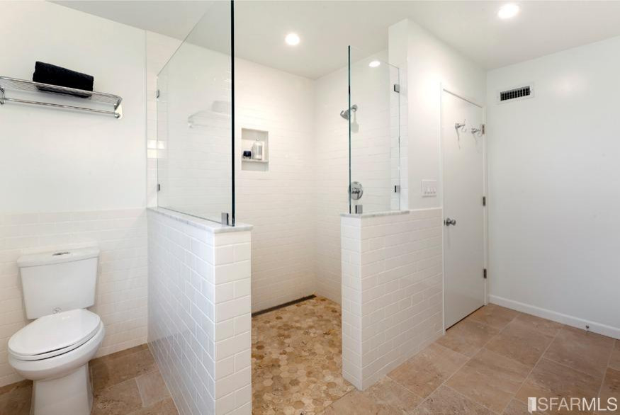 Inspiration for a small modern master bathroom in San Francisco with white walls, shaker cabinets, light wood cabinets, a curbless shower, a two-piece toilet, white tile, ceramic tile, porcelain floors, an undermount sink, engineered quartz benchtops, beige floor, an open shower, white benchtops, a laundry, a single vanity and a built-in vanity.