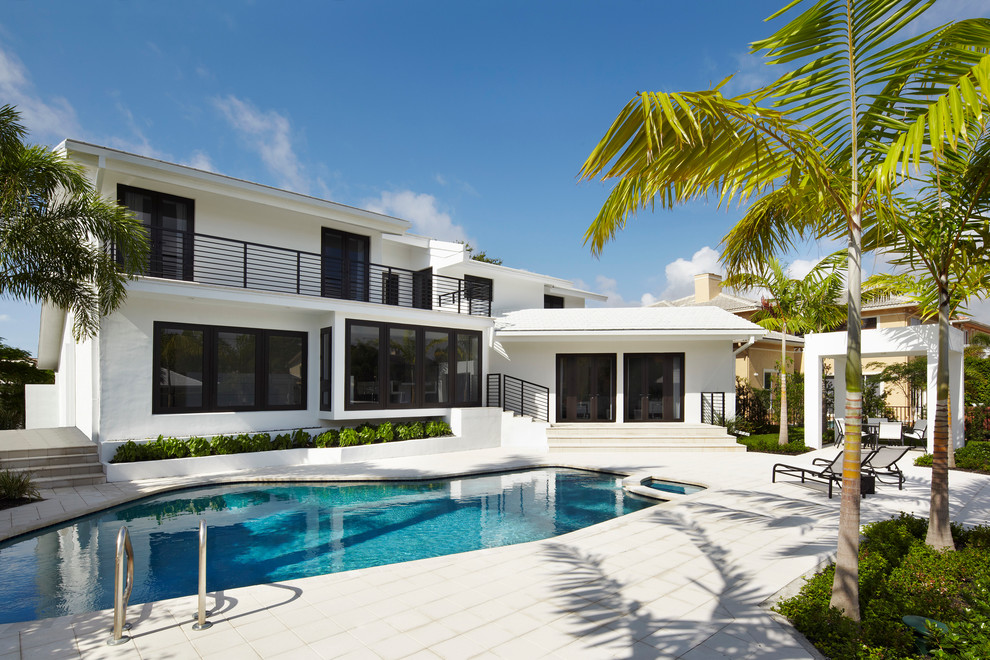 Inspiration for a contemporary two-storey white exterior in Miami.