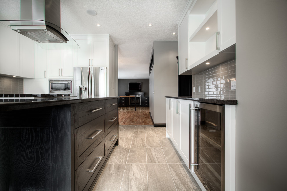 Example of a transitional kitchen design in Calgary