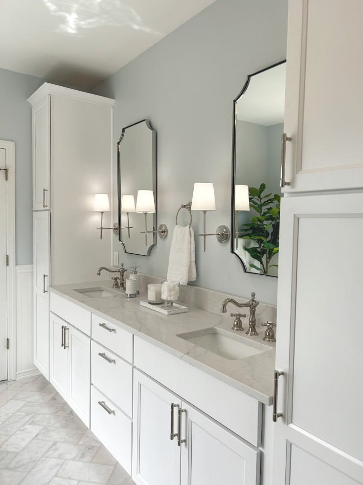 Freestanding bathtub - mid-sized transitional master gray tile and marble tile marble floor, gray floor, double-sink and wainscoting freestanding bathtub idea with shaker cabinets, white cabinets, a two-piece toilet, blue walls, an undermount sink, quartz countertops, a hinged shower door, gray countertops and a built-in vanity