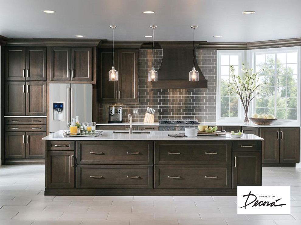 Kitchen - large single-wall white floor kitchen idea with brown cabinets, brown backsplash, stainless steel appliances and an island