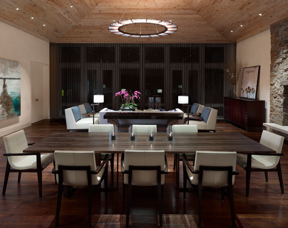Photo of a contemporary dining room in Grand Rapids with white walls and dark hardwood floors.