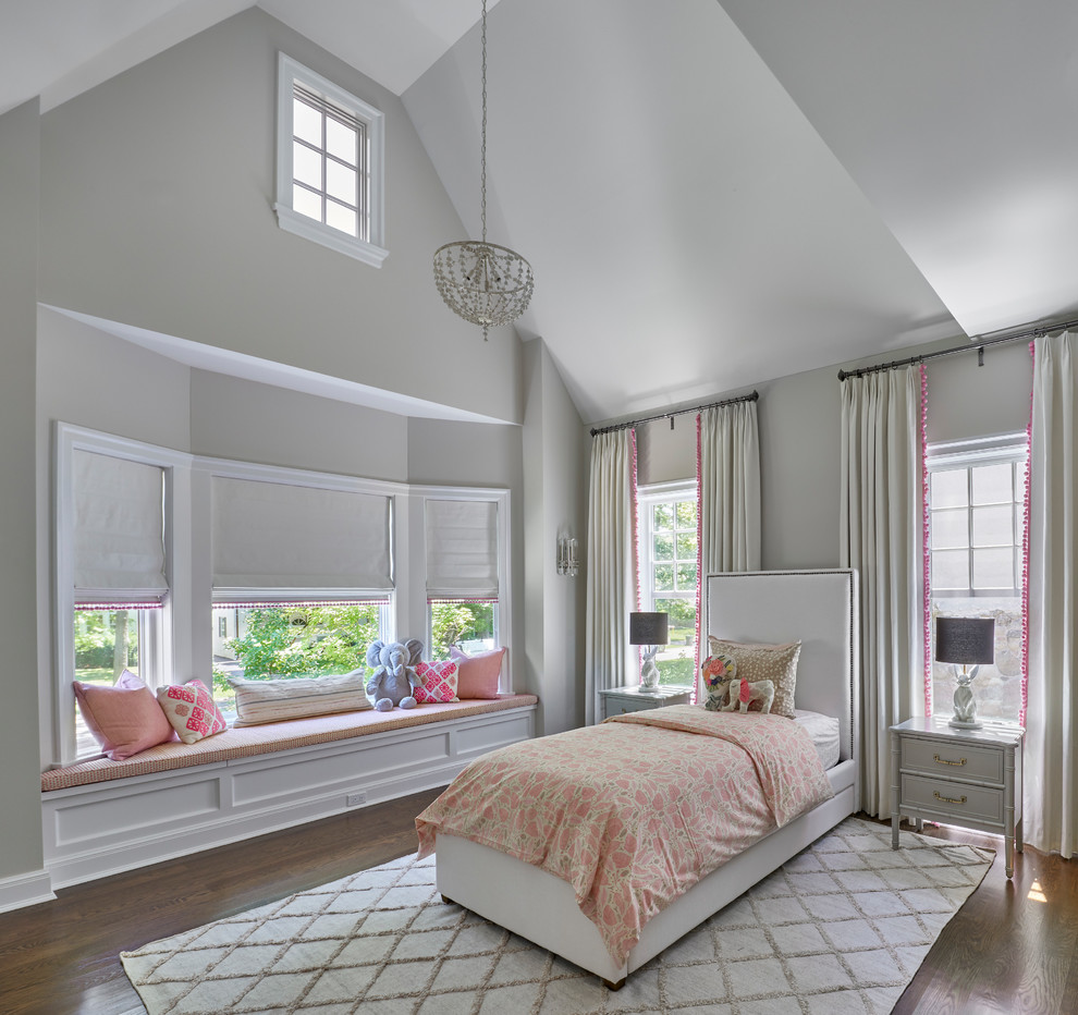 Design ideas for a transitional kids' bedroom for girls in Chicago with grey walls, dark hardwood floors and brown floor.