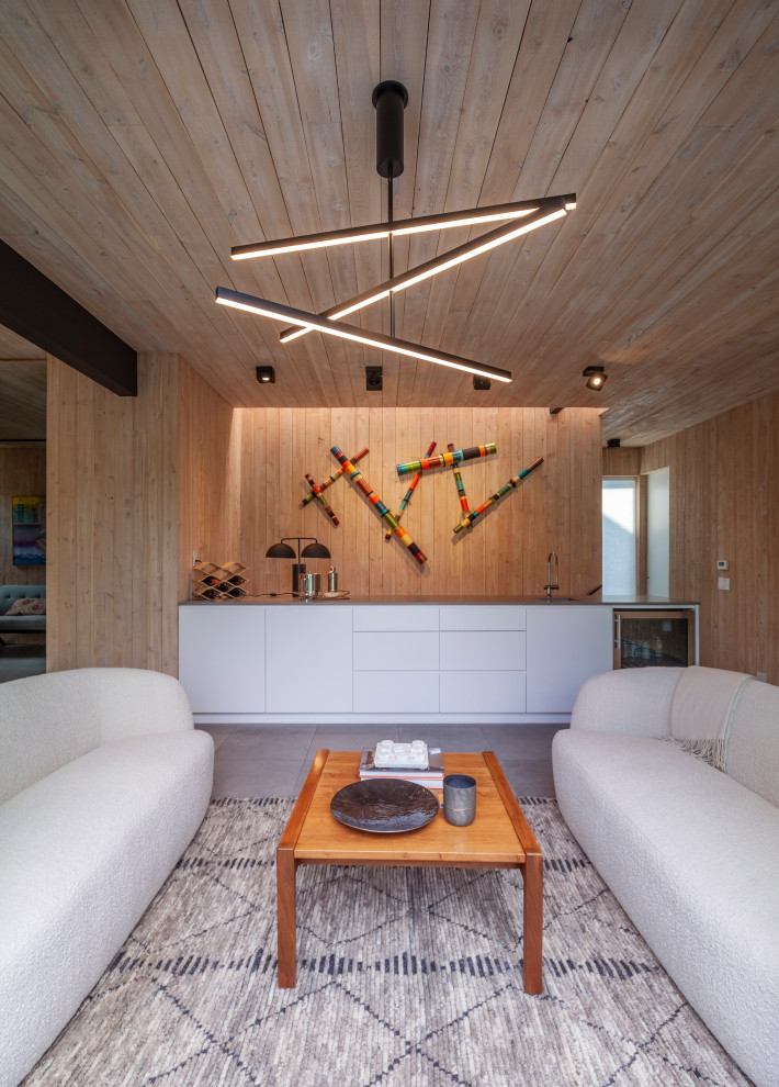 435W and 104N Adams - Example of a mid-sized minimalist open concept concrete floor, gray floor, wood ceiling and wall paneling family room library design in Dallas with brown walls