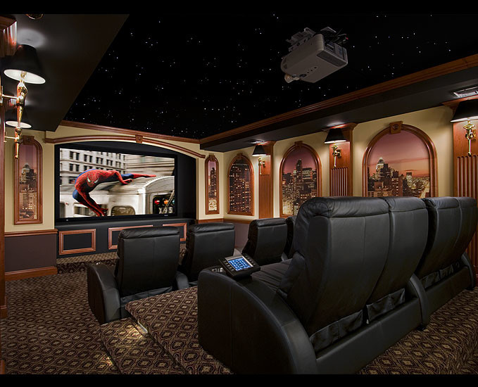 Large traditional enclosed home theatre in New York with beige walls, carpet, a projector screen and brown floor.