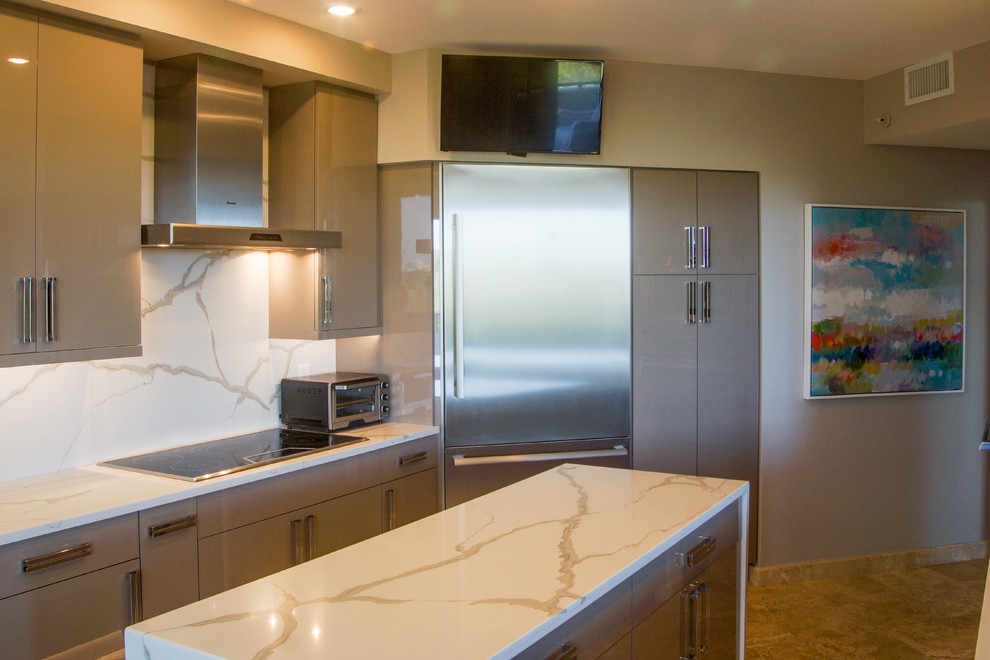 Photo of a mid-sized contemporary galley eat-in kitchen in Tampa with a single-bowl sink, flat-panel cabinets, grey cabinets, quartz benchtops, white splashback, stainless steel appliances and with island.