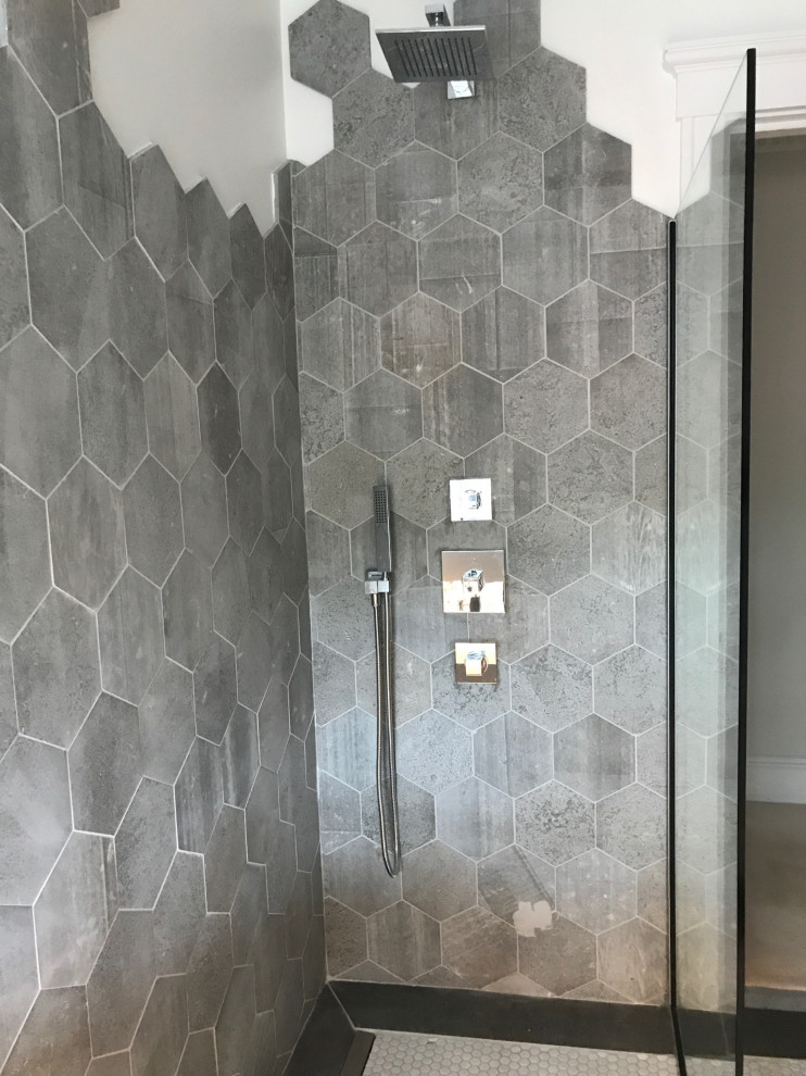 Example of a small trendy 3/4 gray tile and cement tile ceramic tile, white floor and single-sink bathroom design in Philadelphia with white cabinets, a wall-mount toilet, white walls, a wall-mount sink, white countertops and a floating vanity