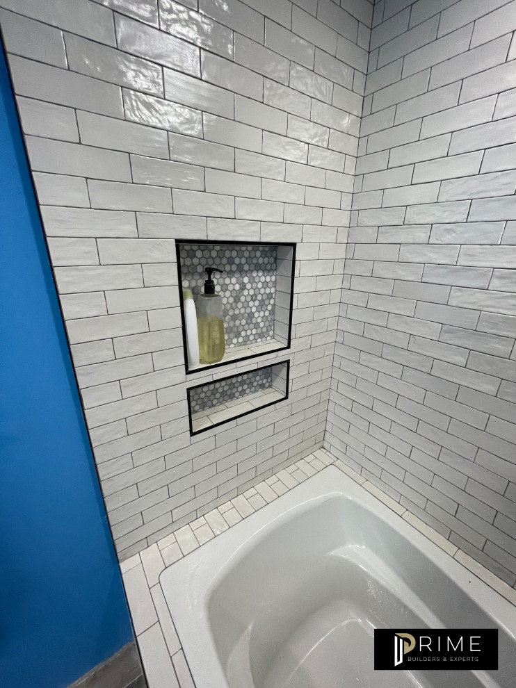 Mid-sized minimalist master white tile and marble tile light wood floor, brown floor and single-sink bathroom photo in Los Angeles with shaker cabinets, blue cabinets, a two-piece toilet, white walls, a console sink, marble countertops, a hinged shower door, white countertops and a built-in vanity