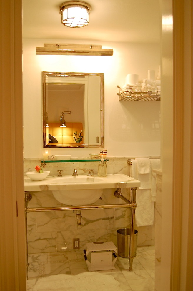 Mid-sized transitional master white tile marble floor bathroom photo with a wall-mount sink, marble countertops and white walls