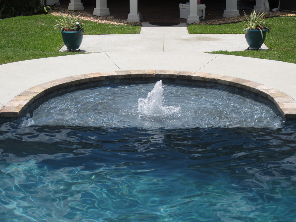 Island style pool photo in Atlanta