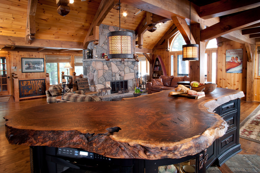Mid-sized mountain style u-shaped medium tone wood floor and brown floor eat-in kitchen photo in Toronto with raised-panel cabinets, distressed cabinets, granite countertops, paneled appliances and an island