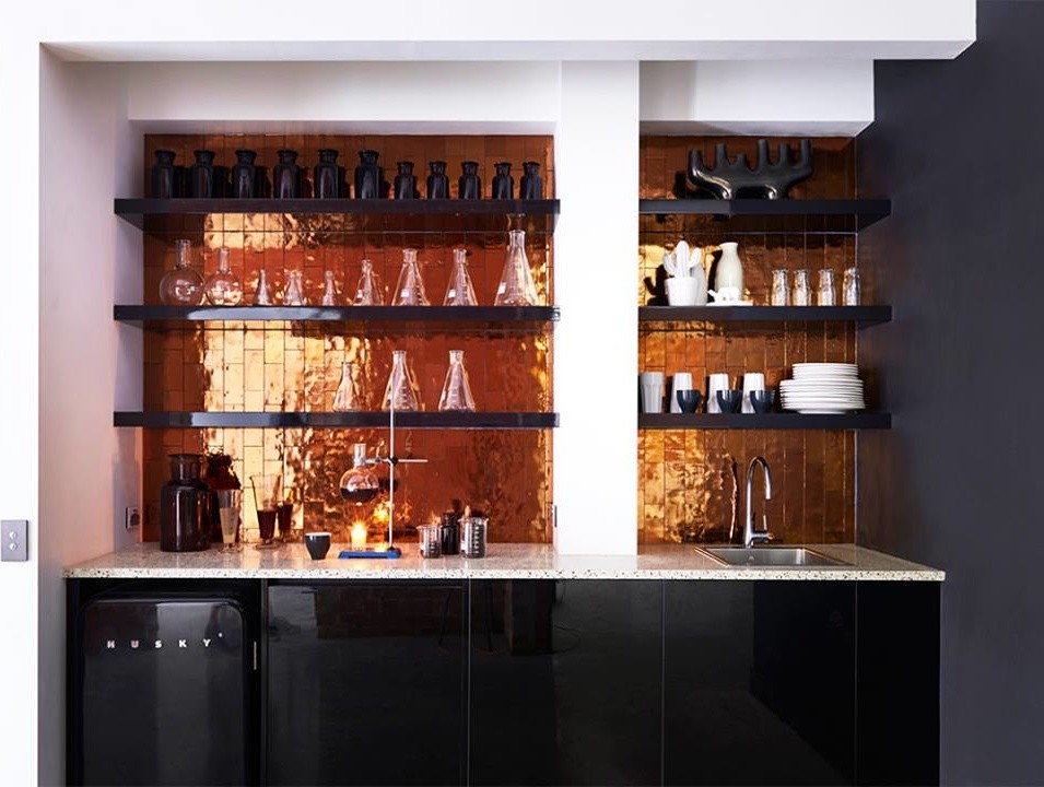 This is an example of a mid-sized contemporary single-wall wet bar in Miami with a drop-in sink, flat-panel cabinets, black cabinets and subway tile splashback.