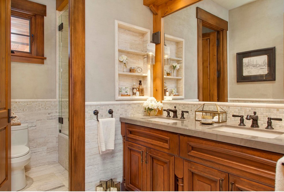 Alcove shower - rustic ceramic tile and beige floor alcove shower idea in Seattle with an undermount sink, raised-panel cabinets, medium tone wood cabinets, a one-piece toilet and beige walls