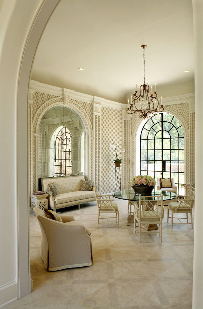 Traditional separate dining room in Atlanta with beige walls and marble floors.