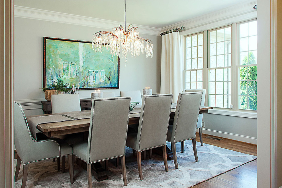 Large traditional dining room in Other with grey walls, dark hardwood floors and brown floor.