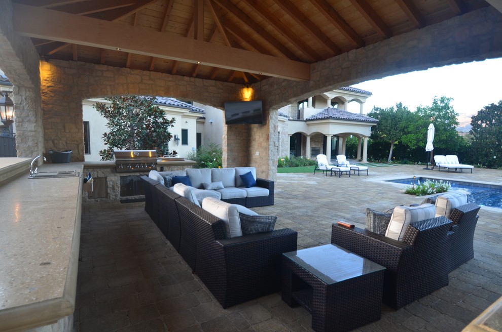 Photo of a large traditional backyard patio in Los Angeles.