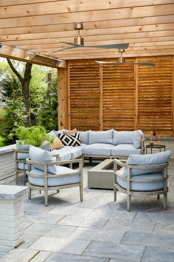 Transitional backyard patio in New York with a pergola.