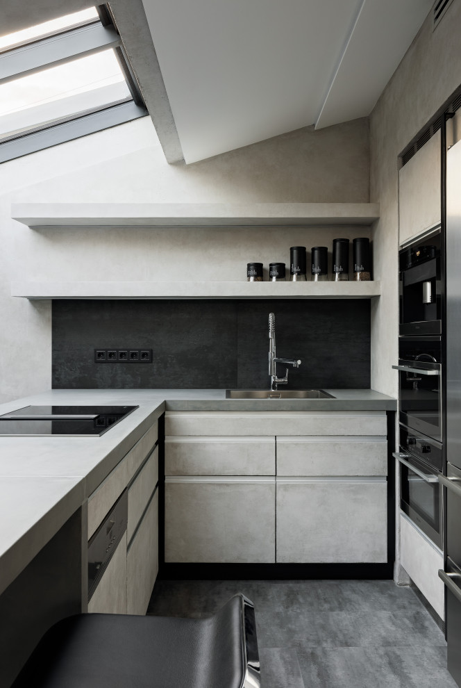 Design ideas for a mid-sized contemporary l-shaped eat-in kitchen in Saint Petersburg with a single-bowl sink, flat-panel cabinets, white cabinets, solid surface benchtops, black splashback, porcelain splashback, black appliances, ceramic floors, with island, grey floor, grey benchtop and vaulted.