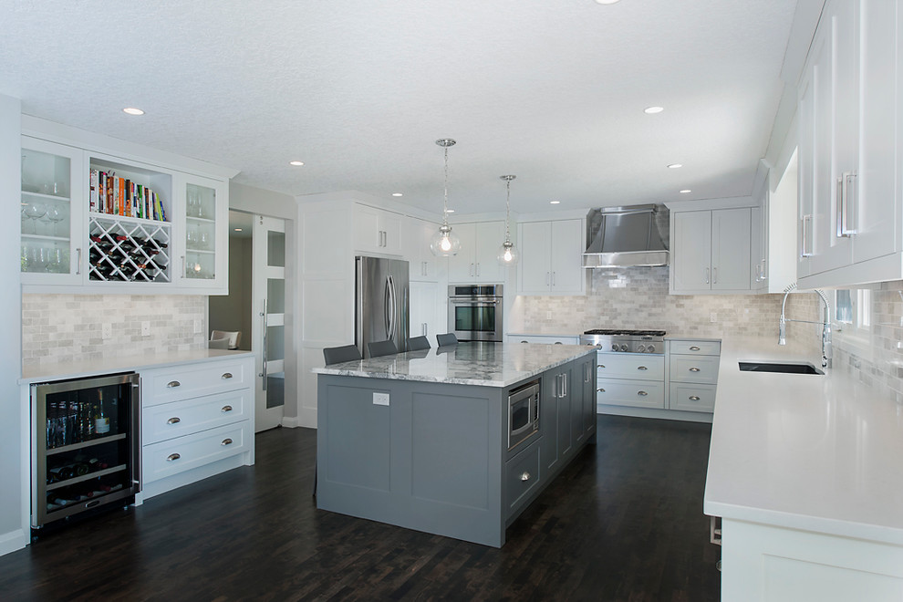 Example of a transitional kitchen design in Calgary