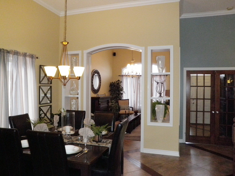 Large traditional dining room in Toronto with beige walls and porcelain floors.