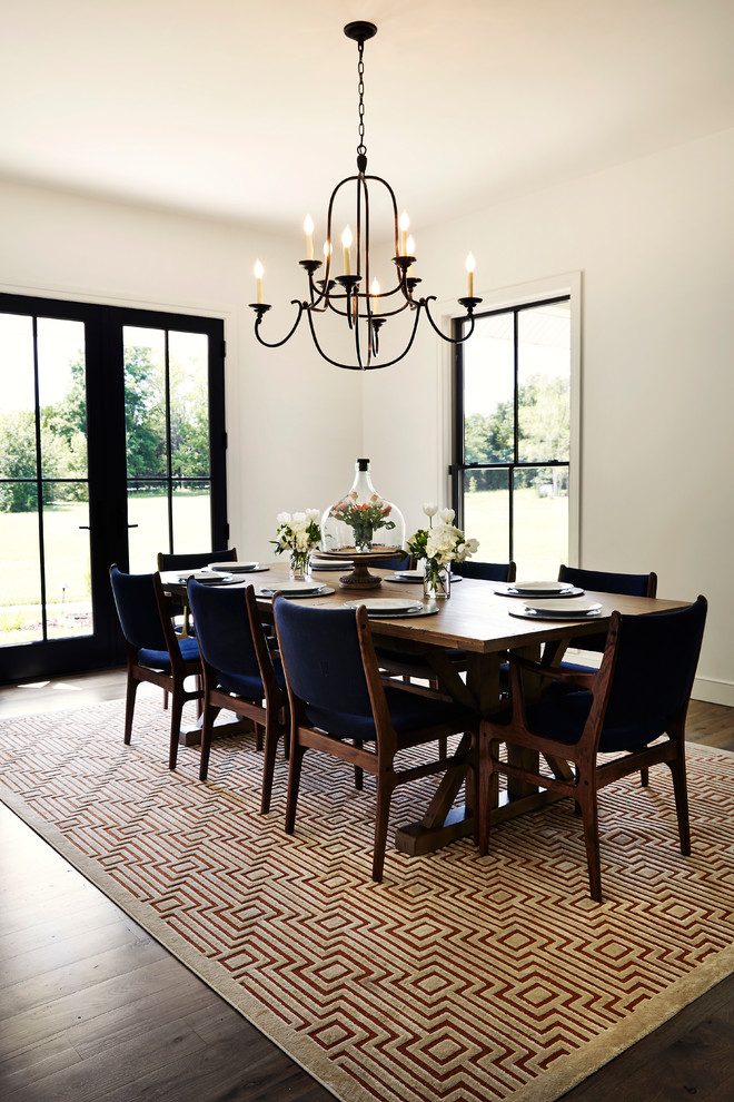 Design ideas for a large country separate dining room in Other with white walls, dark hardwood floors and brown floor.
