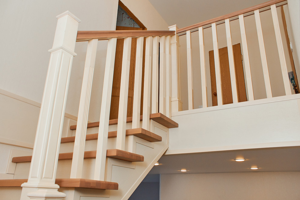 Inspiration for a wood l-shaped staircase in Other with wood risers and wood railing.