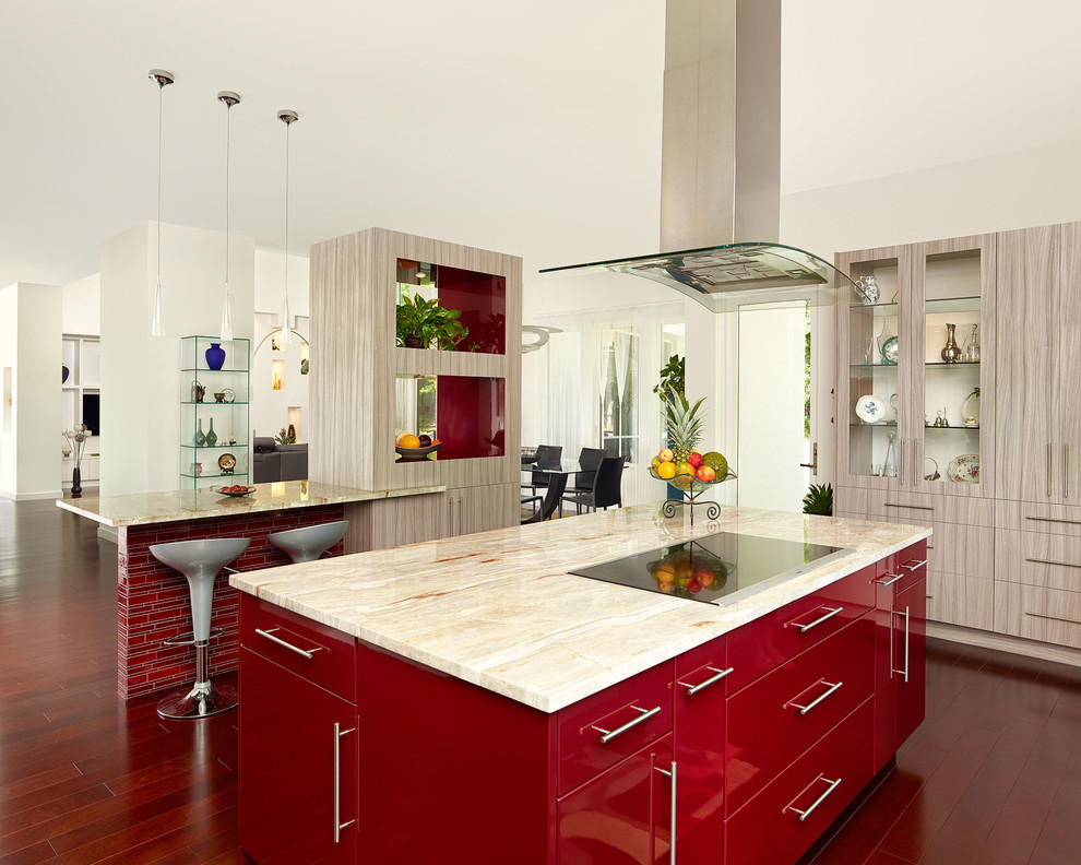 Design ideas for a large contemporary single-wall open plan kitchen in Charleston with flat-panel cabinets, granite benchtops, dark hardwood floors, multiple islands, red cabinets, brown floor and beige benchtop.