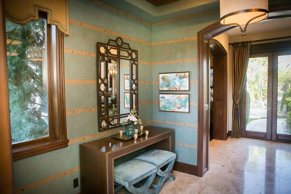 Mid-sized transitional travertine floor foyer photo in Orange County with multicolored walls and a metal front door