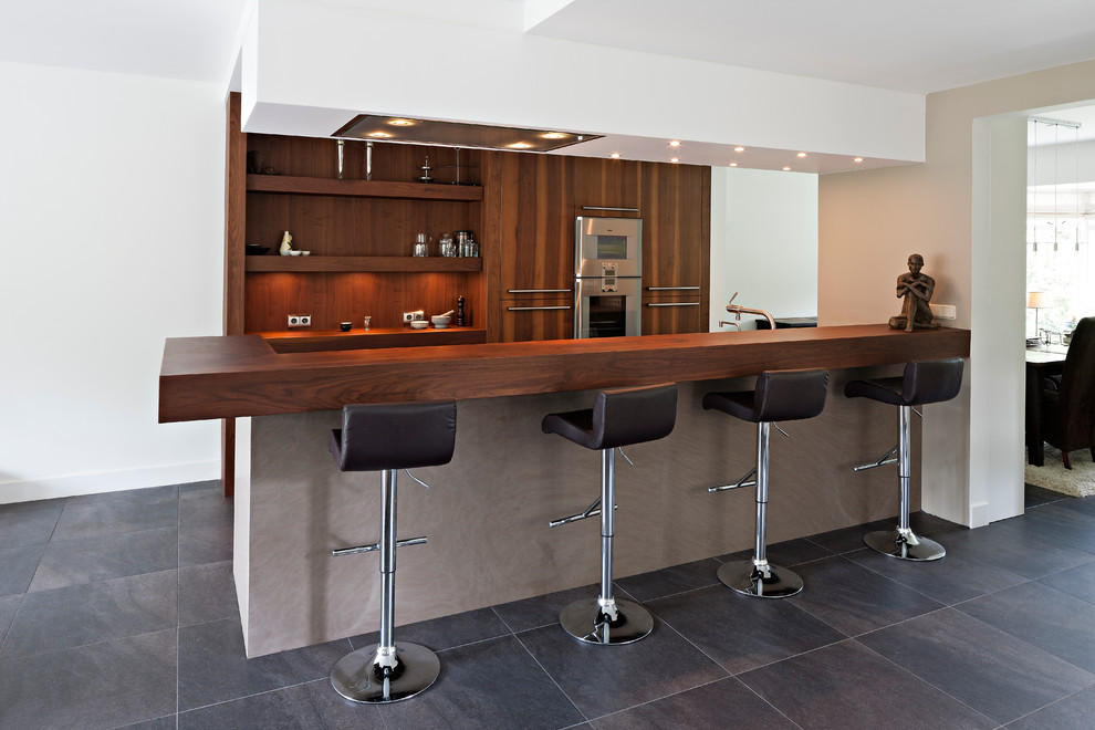 Inspiration for a contemporary kitchen in New York with wood benchtops.