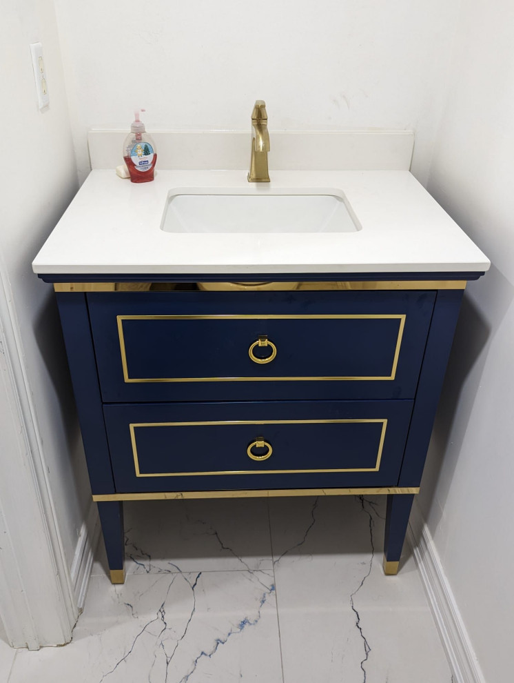Small modern cloakroom in Toronto with freestanding cabinets, blue cabinets, a bidet, white walls, ceramic flooring, an integrated sink, quartz worktops, blue floors, white worktops and a freestanding vanity unit.