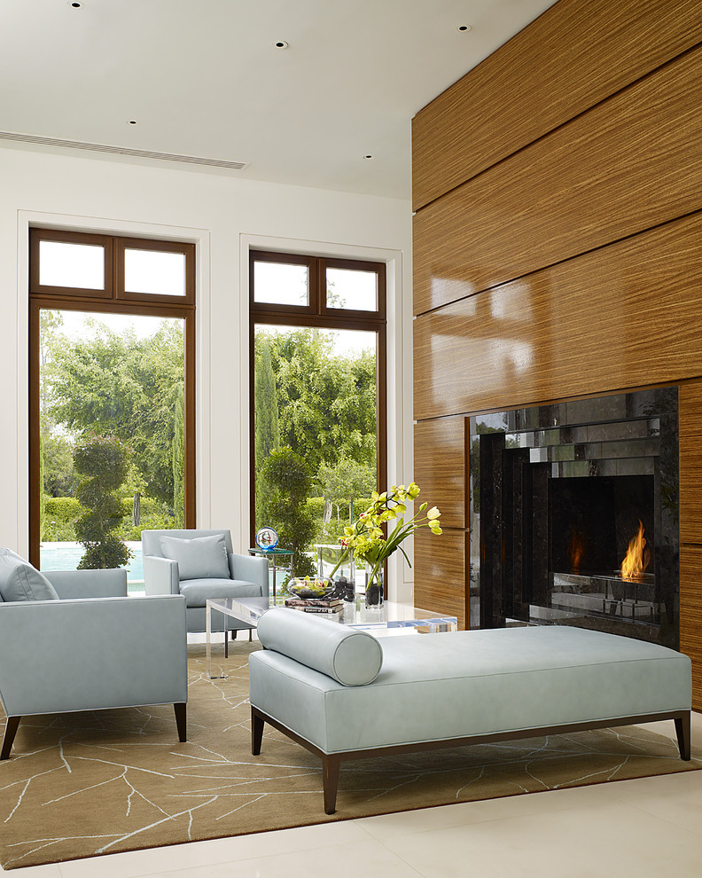 This is an example of a mid-sized asian open concept living room in Miami with white walls.