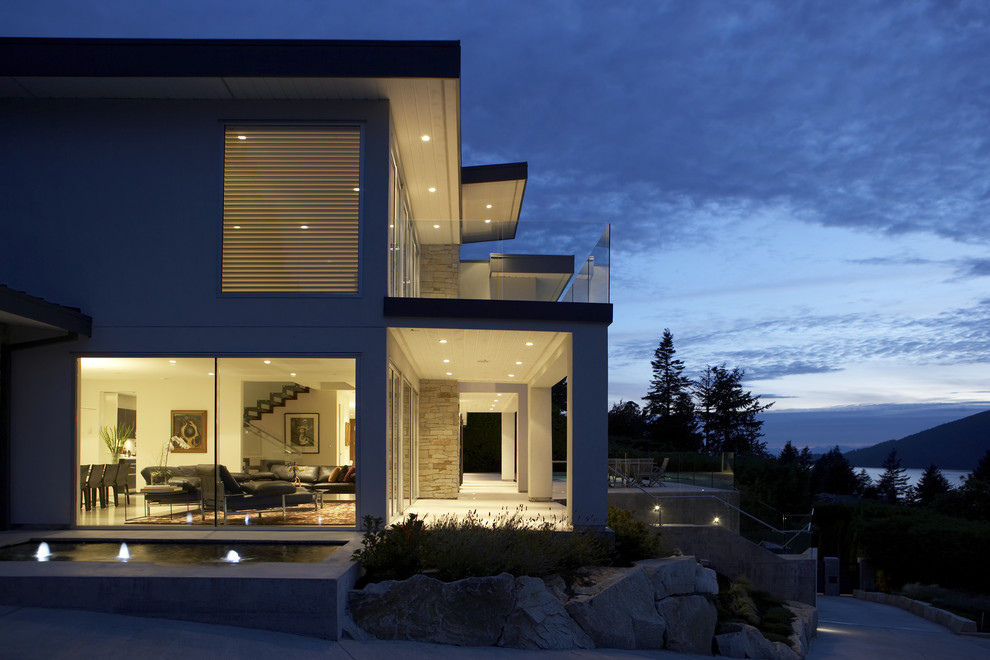 Inspiration for a modern exterior in Vancouver with stone veneer.